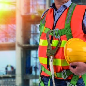 engineer wear fall arrest equipment on site  background